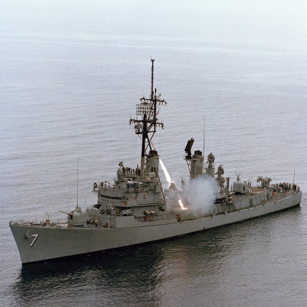 Home Comforts An aerial port bow view of the guided missile destroyer USS Henry B. Wilson (DDG-7) firing an RUR-5A