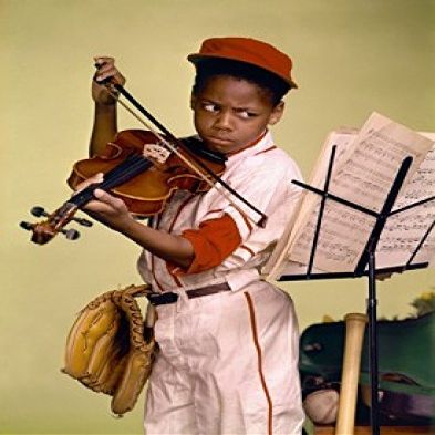 Close-up of a boy looking at a musical stand and playing a violin Poster Print (24 x 36)