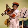 Close-up of a boy looking at a musical stand and playing a violin Poster Print (24 x 36) view 1