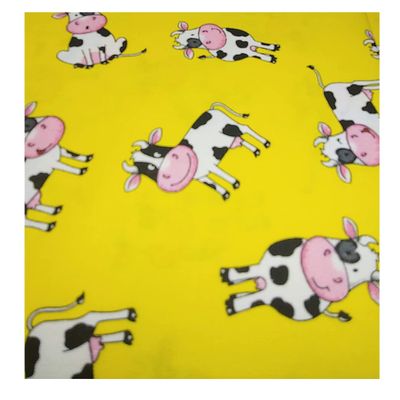 Cows- Tossed on Yellow Fabtic by the yard