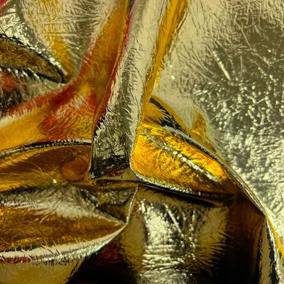 Fashion Fabrics LLC Gold Crushed Distressed Foil Chrome Mirror Reflective Vinyl Fabric - Sold by The Yard